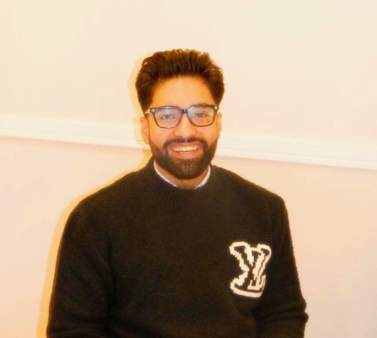 Kamran Zahid seated at a dinner table